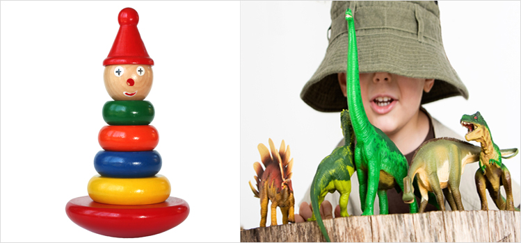 Wooden toy and a boy playing dinosaurs 749px.jpg